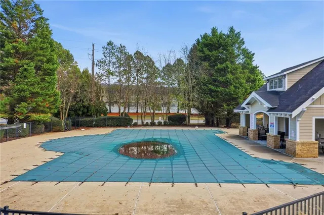 a view of a swimming pool with a patio