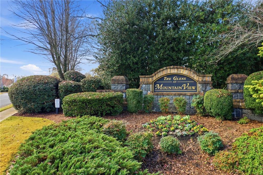 1527 Anna Ruby Lane Kennesaw, GA 30152 - Photo 7 of 42 a front view of a house with garden