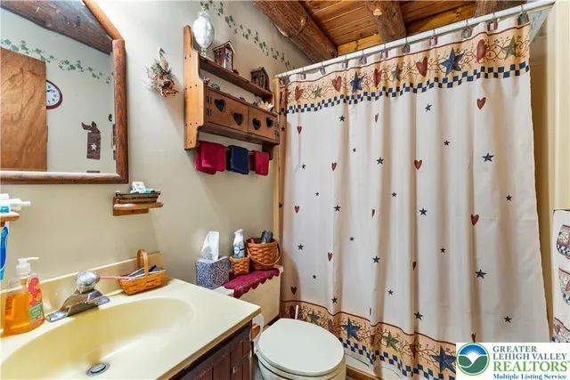 a bedroom with a bed next to a window with yard