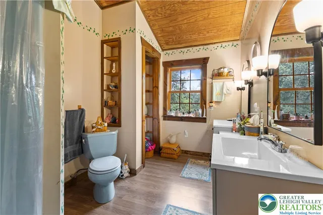 a view of a patio with table and chairs and potted plants