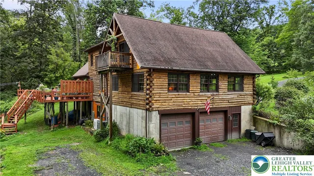 a backyard of a house with a tree