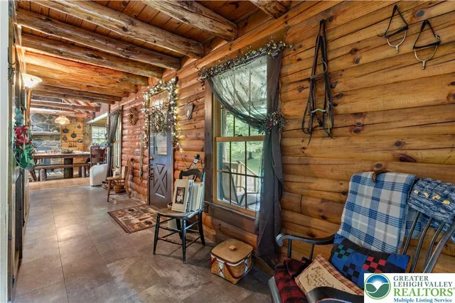 a living room with lots of furniture and a rug