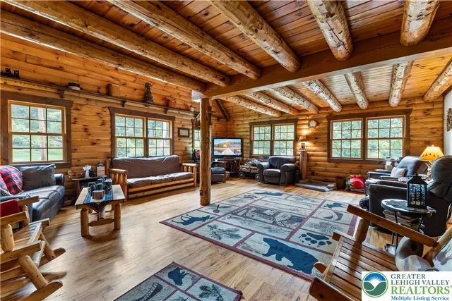 a outdoor living space with furniture and a rug