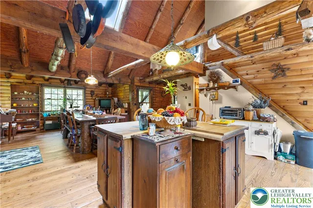 a view of a porch with a dining table and chairs
