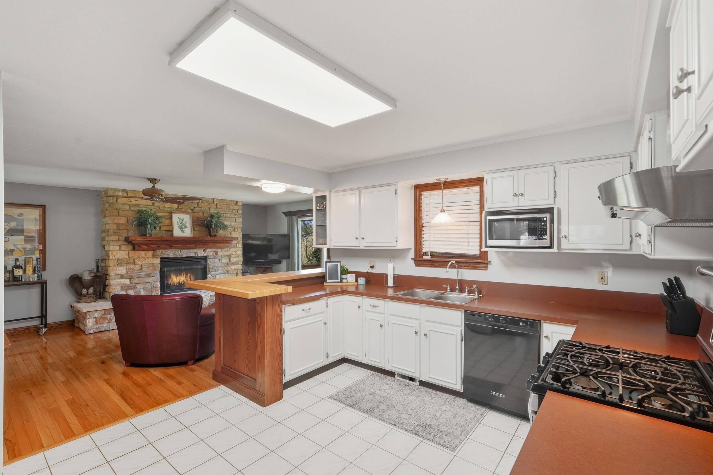 2325 Drop Anchor Drive Crown Point, IN 46307 - Photo 17 of 28 a large white kitchen with cabinets a sink and appliances