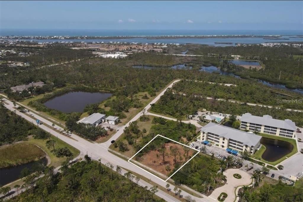 326 Rotonda Boulevard West Rotonda West, FL 33947 - Photo 1 of 1 an aerial view of residential houses with outdoor space