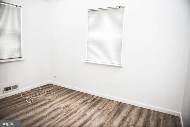a view of a small space with wooden floor