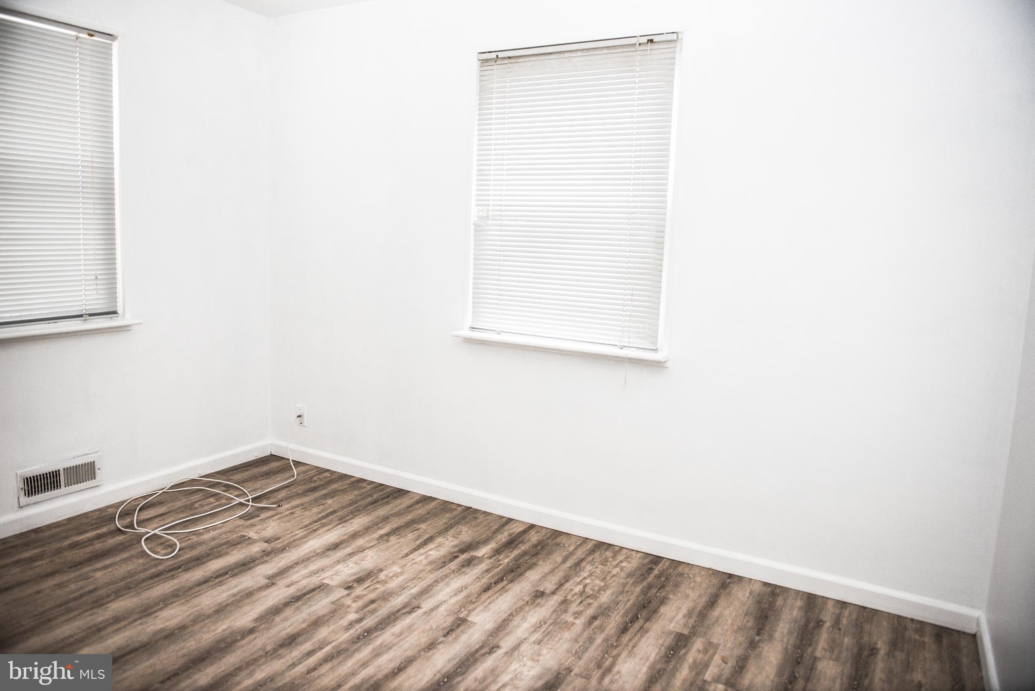 521 Warren Road, Unit 2 Cockeysville, MD 21030 - Photo 12 of 19 a view of a small space with wooden floor and a window