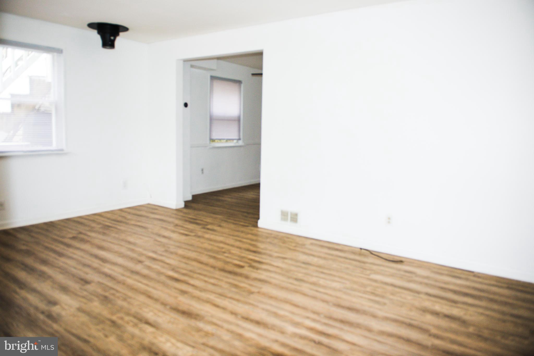 521 Warren Road, Unit 2 Cockeysville, MD 21030 - Photo 3 of 19 a view of empty room with wooden floor