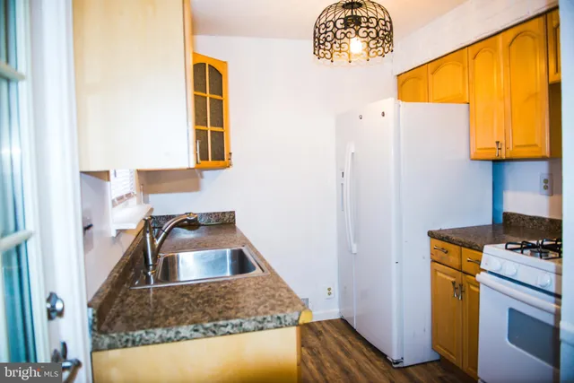 a kitchen that has a sink and a stove