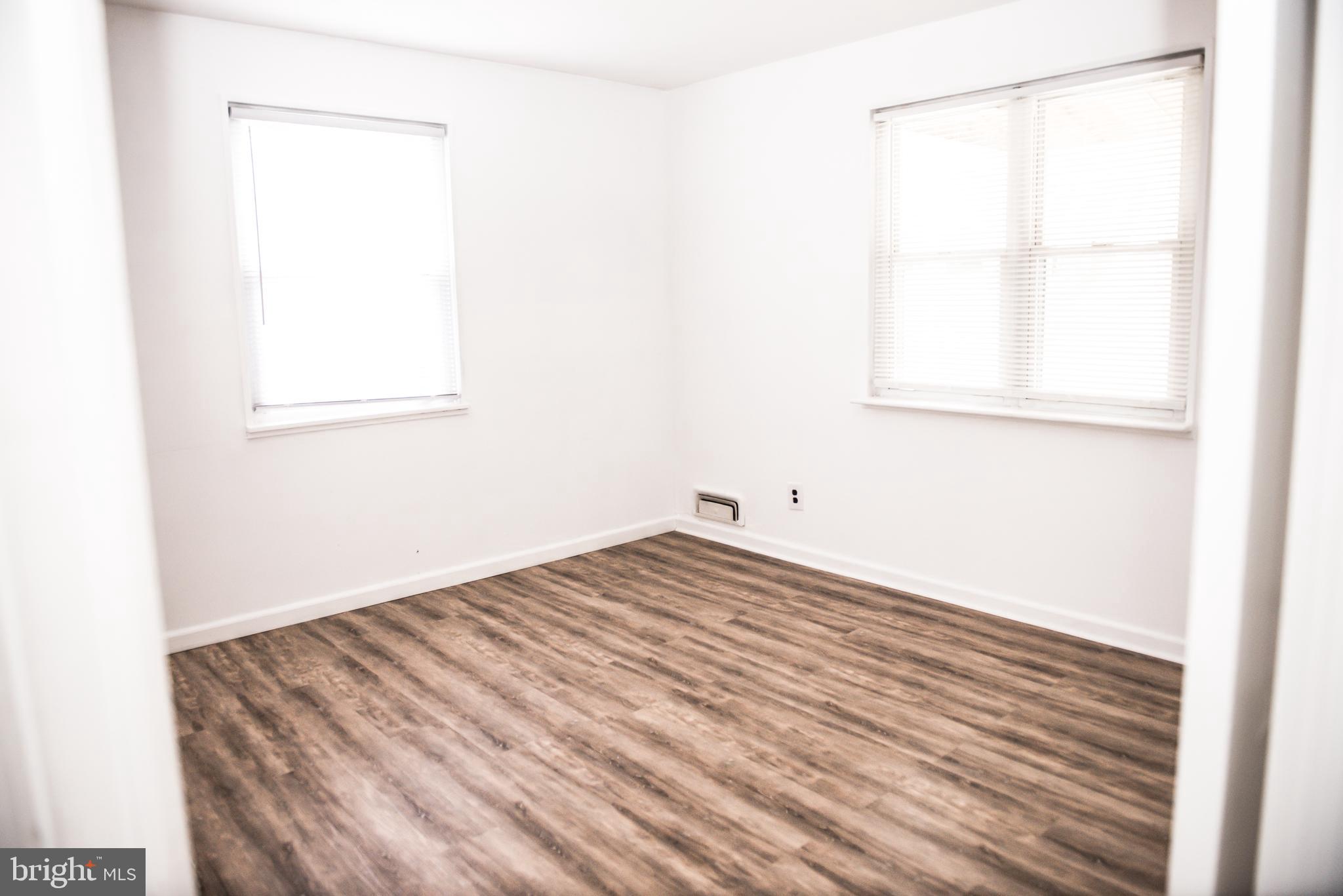 521 Warren Road, Unit 2 Cockeysville, MD 21030 - Photo 10 of 19 a view of a room with wooden floor and a window