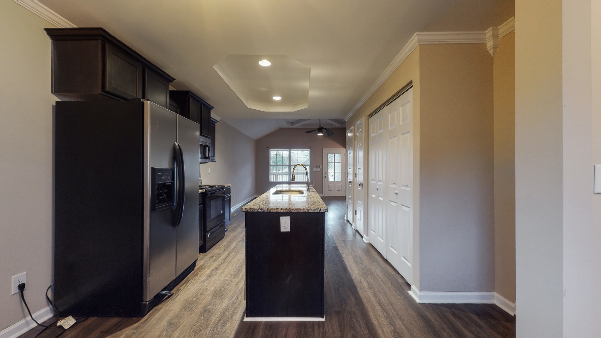 218 Larkin Springs Road Madison, TN 37115 - Photo 6 of 20 a view of a hallway with wooden floor and staircase