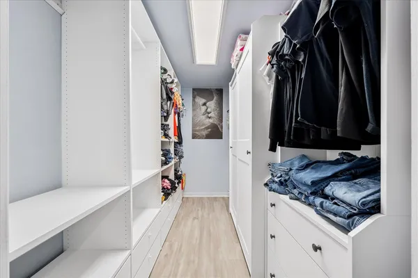 a bedroom with a bed and a desk