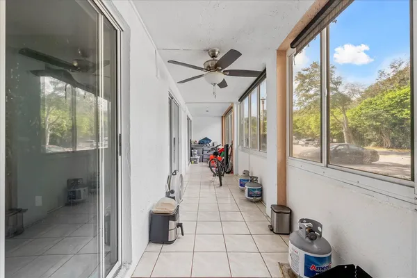 a view of open kitchen with stainless steel appliances granite countertop a refrigerator and a sink