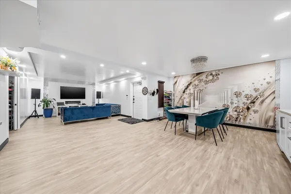 a view of a dining room with furniture and wooden floor