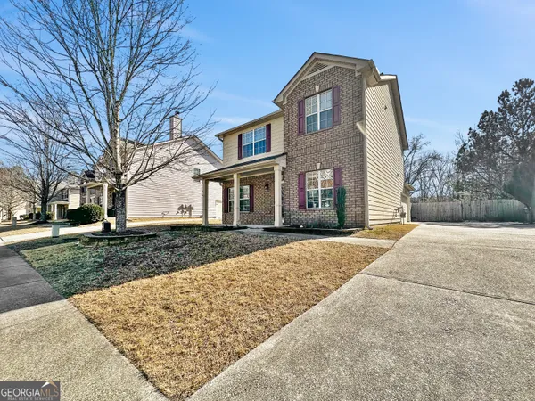 front view of a house with a yard