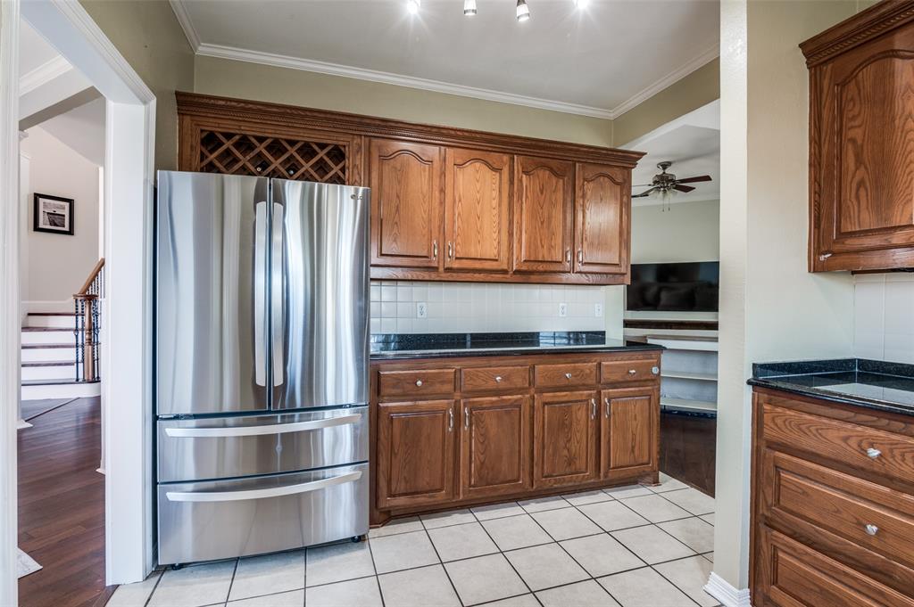168 Hunters Glen Waxahachie, TX 75167 - Photo 11 of 29 a kitchen with stainless steel appliances granite countertop a refrigerator and a sink