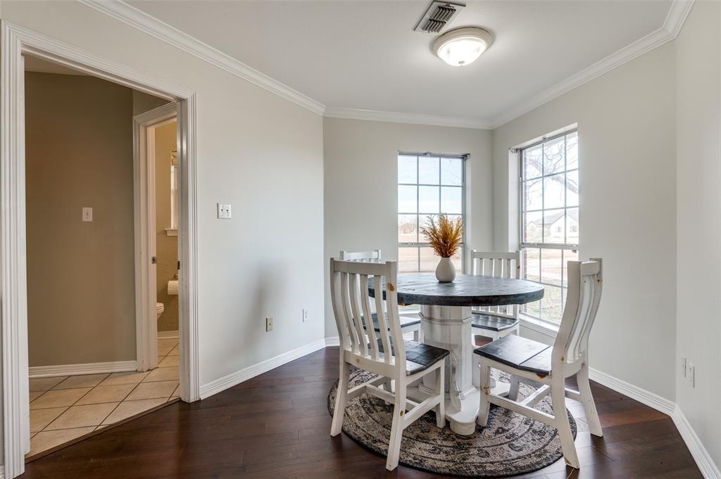 168 Hunters Glen Waxahachie, TX 75167 - Photo 12 of 29 a view of a dining room with furniture window and wooden floor