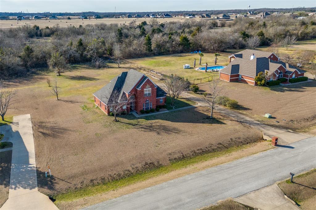 168 Hunters Glen Waxahachie, TX 75167 - Photo 25 of 29 a view of a swimming pool with a yard and mountain view