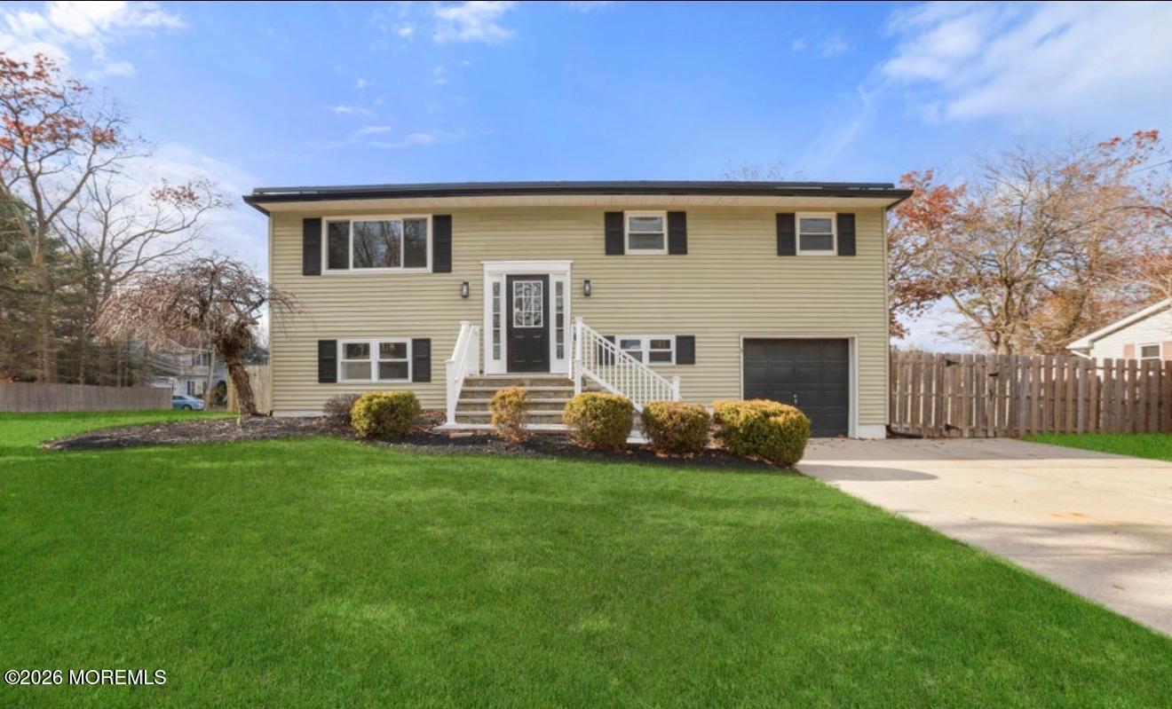 112 Manhattan Street Jackson, NJ 08527 - Photo 1 of 41 a front view of a house with a garden
