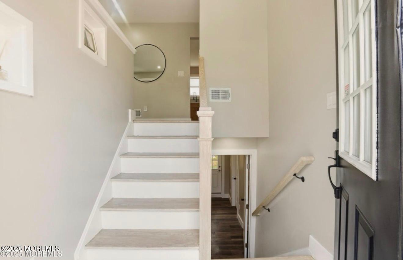 112 Manhattan Street Jackson, NJ 08527 - Photo 6 of 41 a view of staircase with white walls and white door