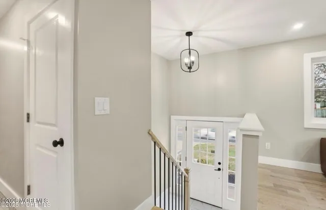 a view of a hallway with windows