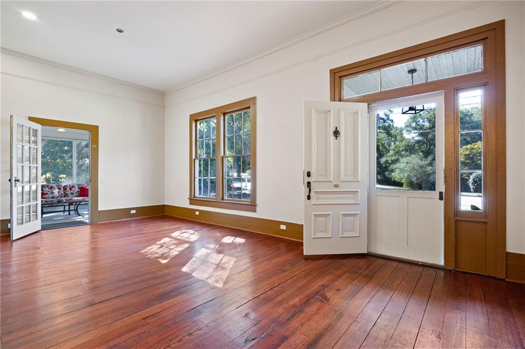4284 Marietta Street Powder Springs, GA 30127 - Photo 13 of 70 a view of an empty room with wooden floor and a window