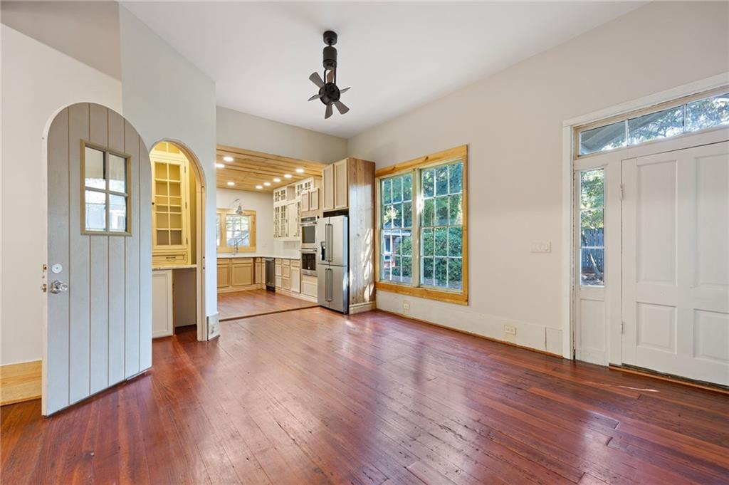 4284 Marietta Street Powder Springs, GA 30127 - Photo 16 of 70 a view of a room with wooden floor ceiling fan and windows