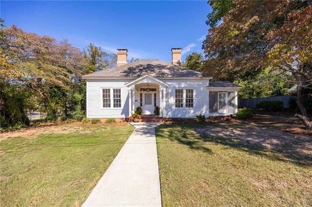 4284 Marietta Street Powder Springs, GA 30127 - Photo 2 of 70 a front view of a house with swimming pool