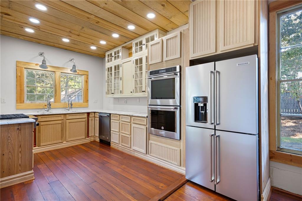 4284 Marietta Street Powder Springs, GA 30127 - Photo 21 of 70 a kitchen with stainless steel appliances a refrigerator sink and microwave