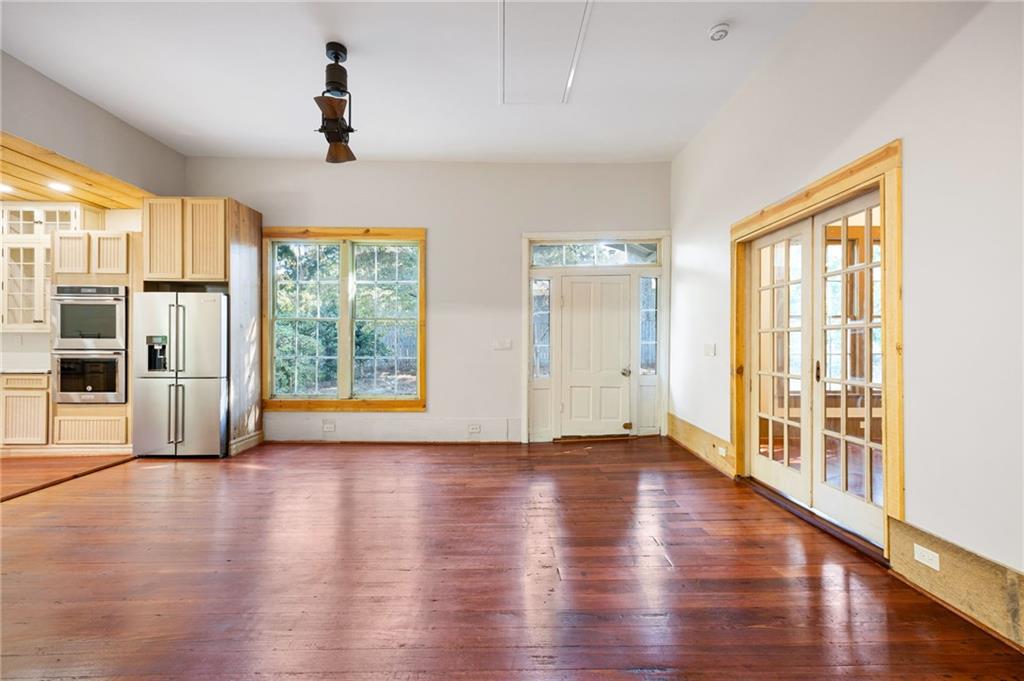 4284 Marietta Street Powder Springs, GA 30127 - Photo 24 of 70 a view of an empty room with wooden floor and a window