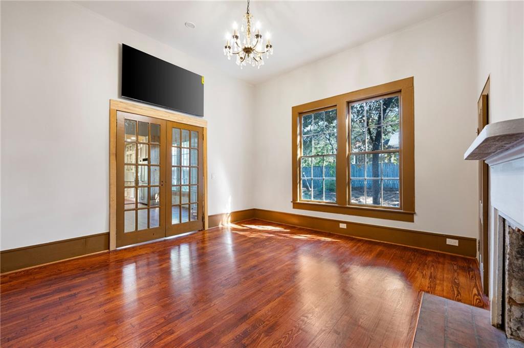 4284 Marietta Street Powder Springs, GA 30127 - Photo 30 of 70 a view of an empty room with wooden floor and a window