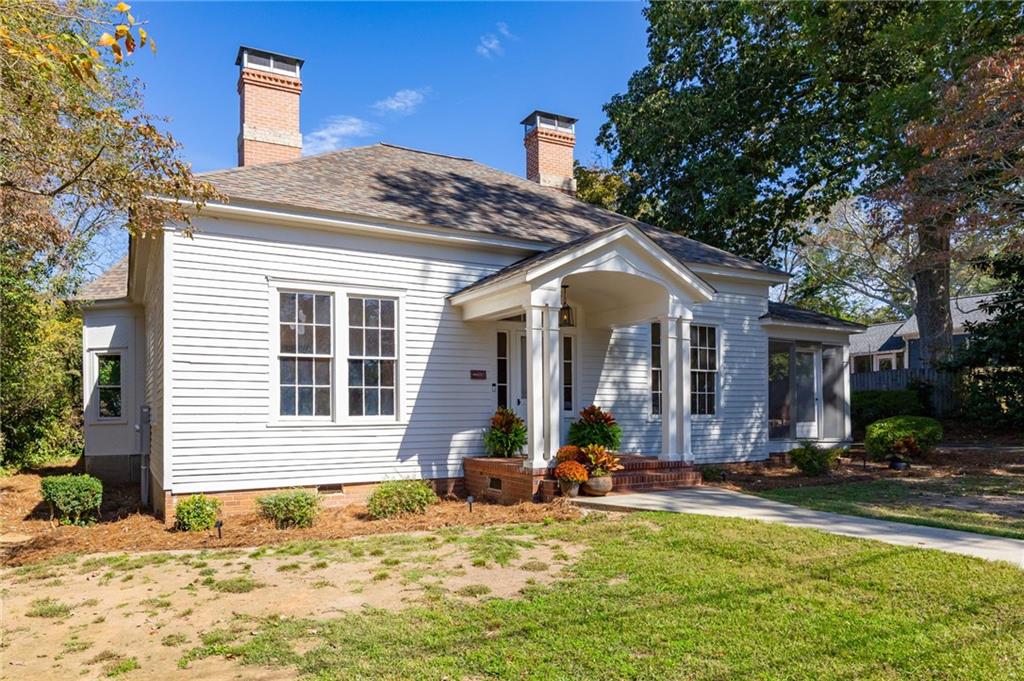 4284 Marietta Street Powder Springs, GA 30127 - Photo 3 of 70 a front view of a house with swimming pool and porch