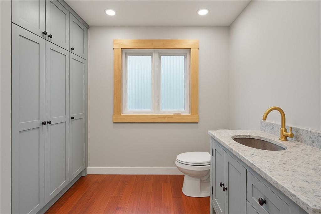 4284 Marietta Street Powder Springs, GA 30127 - Photo 34 of 70 a bathroom with a granite countertop sink toilet and shower