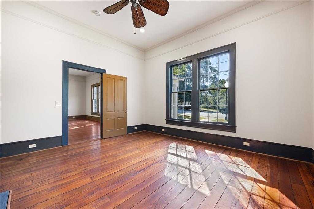 4284 Marietta Street Powder Springs, GA 30127 - Photo 36 of 70 an empty room with wooden floor and windows