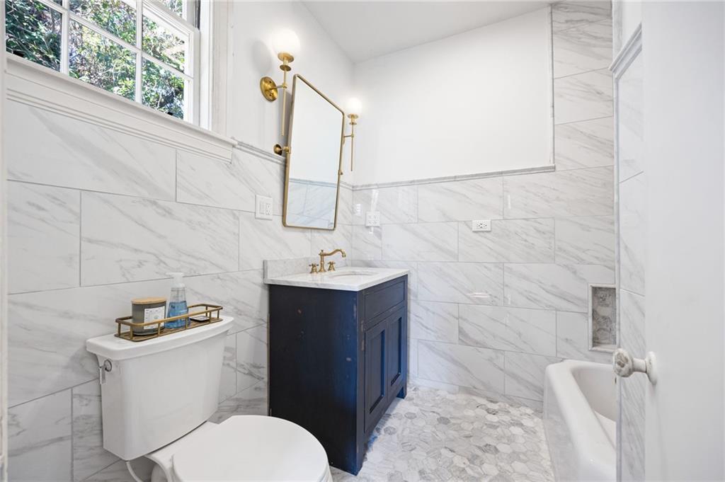 4284 Marietta Street Powder Springs, GA 30127 - Photo 38 of 70 a bathroom with a sink toilet and mirror