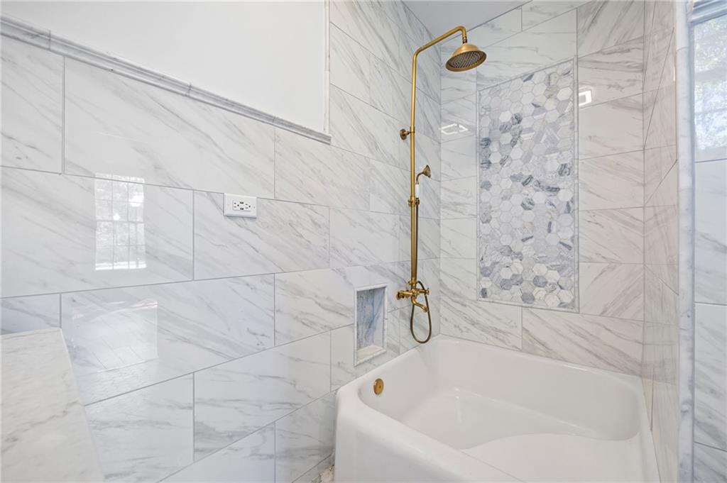 4284 Marietta Street Powder Springs, GA 30127 - Photo 39 of 70 a bathroom with a bathtub