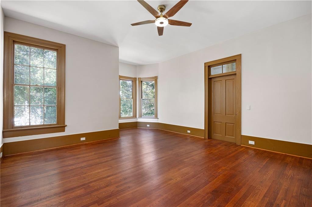 4284 Marietta Street Powder Springs, GA 30127 - Photo 40 of 70 a view of an empty room with wooden floor and a window