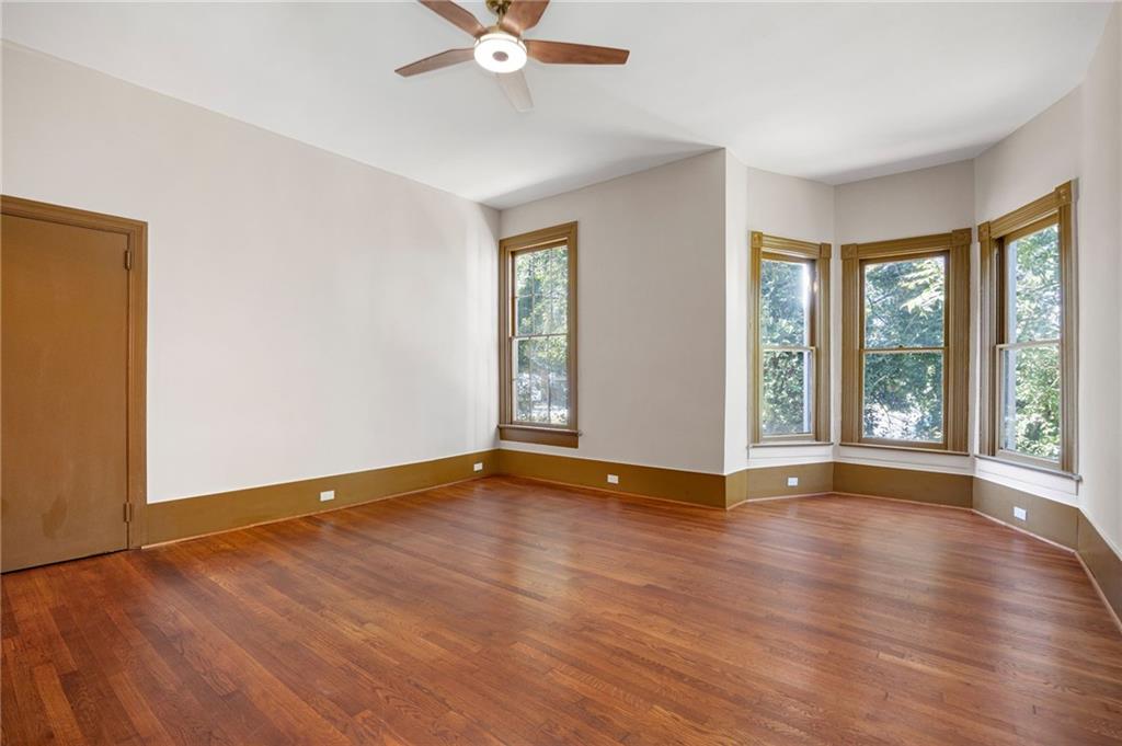 4284 Marietta Street Powder Springs, GA 30127 - Photo 41 of 70 a view of an empty room with wooden floor and a window