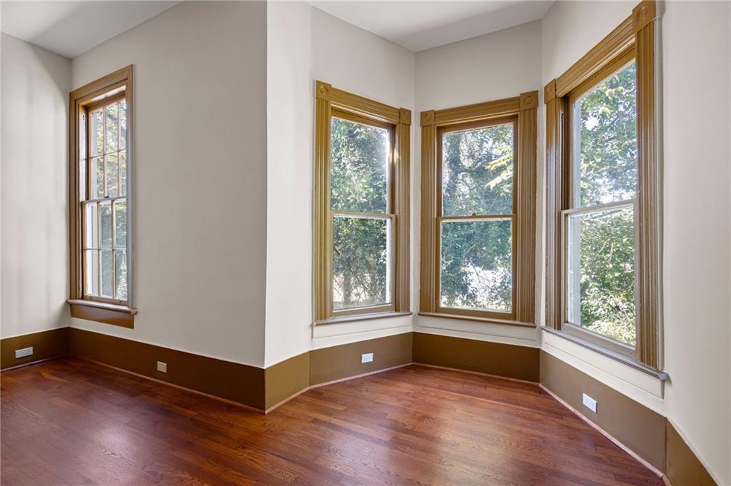 4284 Marietta Street Powder Springs, GA 30127 - Photo 42 of 70 a view of an empty room with wooden floor and a window