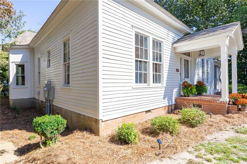 4284 Marietta Street Powder Springs, GA 30127 - Photo 50 of 70 a front view of a house with garden