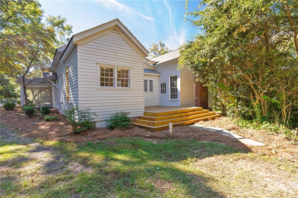 4284 Marietta Street Powder Springs, GA 30127 - Photo 52 of 70 a backyard of a house with table and chairs