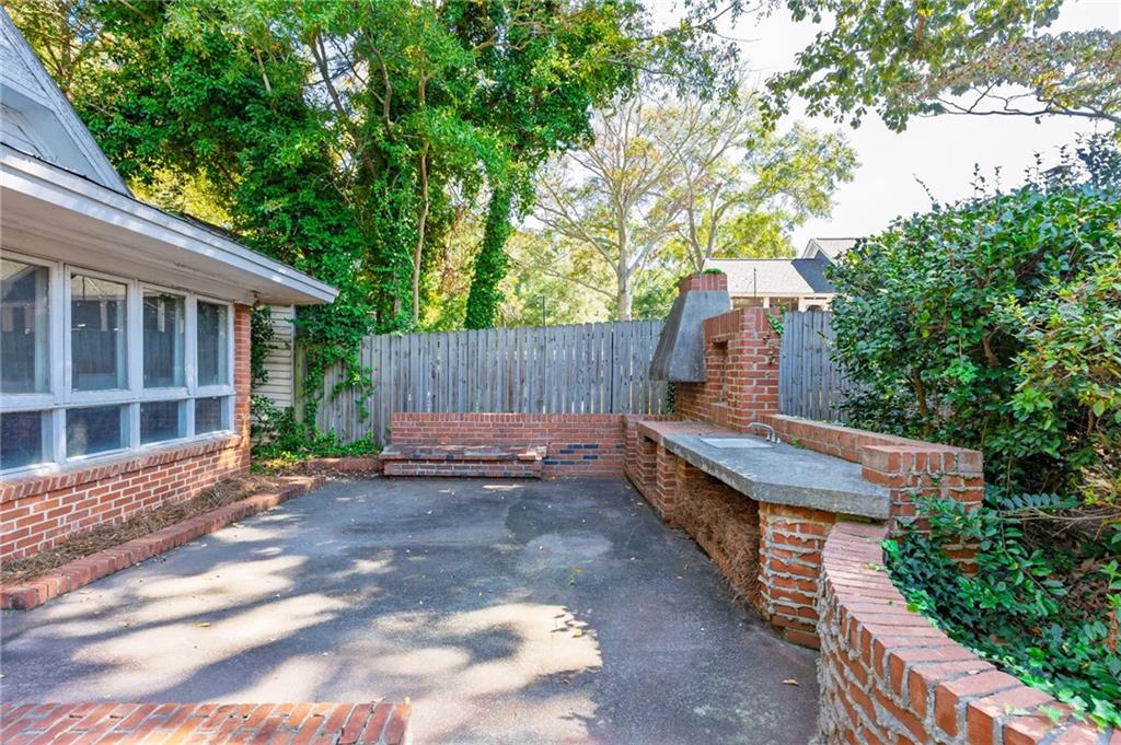 4284 Marietta Street Powder Springs, GA 30127 - Photo 57 of 70 a view of a backyard with a tub and wooden fence