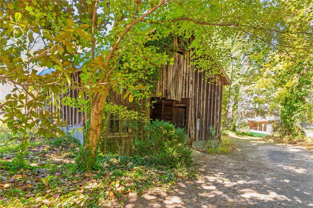 4284 Marietta Street Powder Springs, GA 30127 - Photo 59 of 70 a plant is in front of a yard