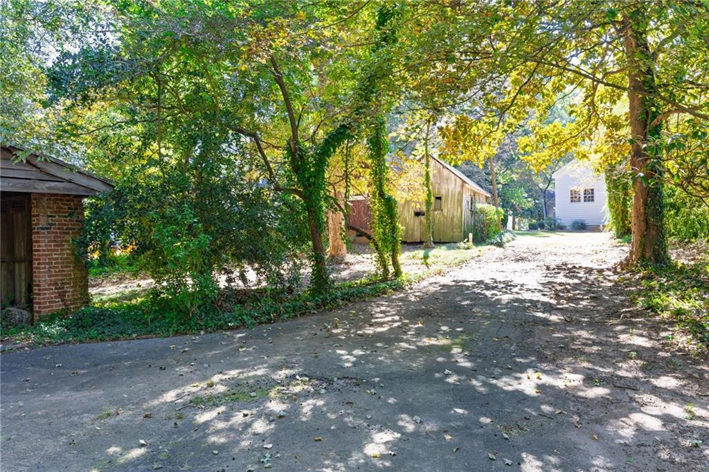4284 Marietta Street Powder Springs, GA 30127 - Photo 61 of 70 a view of a road with a house in the background