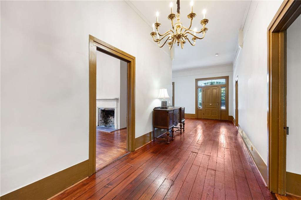4284 Marietta Street Powder Springs, GA 30127 - Photo 8 of 70 a view of a livingroom with wooden floor and a ceiling fan