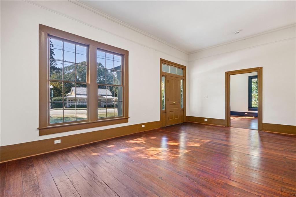 4284 Marietta Street Powder Springs, GA 30127 - Photo 10 of 70 a view of an empty room with wooden floor and a window
