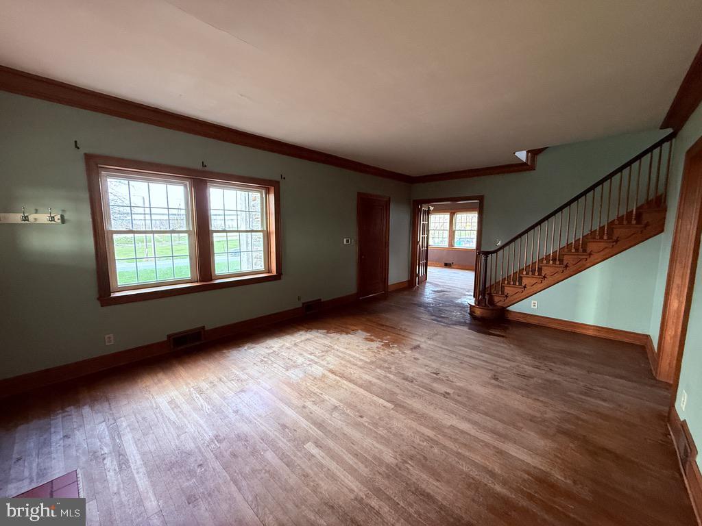6245 Middleburg Road Keymar, MD 21757 - Photo 45 of 77 a view of an empty room with wooden floor and a window