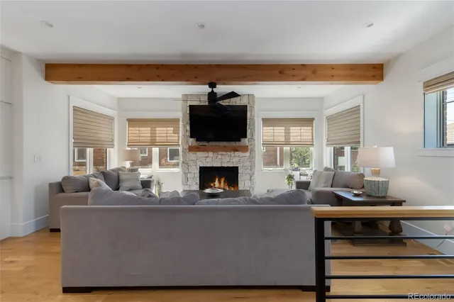 a living room with furniture and kitchen view