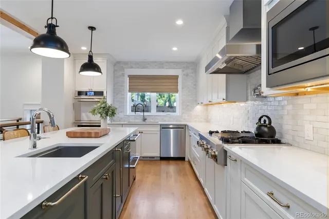 a kitchen with a stove and a refrigerator